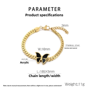 Detailed view of 18k gold plated Cuban chain bracelet with black acrylic butterfly pendant