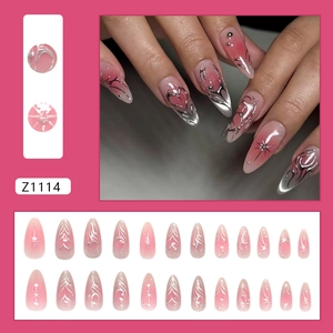 Pink and silver gradient almond press-on nails with metallic heart and star art