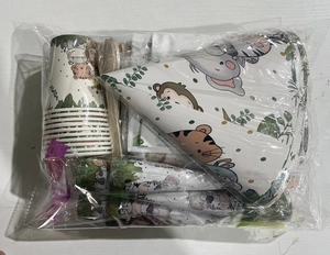 Jungle safari party set with paper plates and animal printed cups in plastic packaging