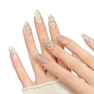 Pink gradient cat-eye press-on nails with silver glitter rhinestones and star pattern