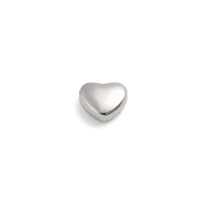 Close-up of a polished silver heart-shaped bead made of stainless steel for jewelry making