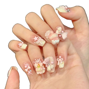 Cute 3D cartoon press-on nails featuring pink bows, stars, and cream yellow finish