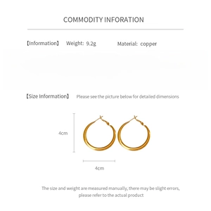 Detailed view of 40mm golden copper hoop earrings with silver pins and size specifications
