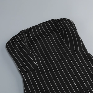 Detail of silver rhinestone stripes on black strapless dress with vertical patterns
