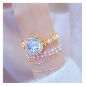 Luxury gold women's quartz watch with sparkling rhinestones and pearl chain bracelets