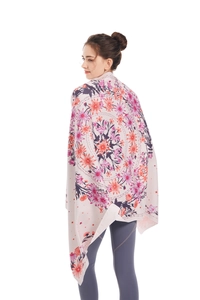 Detailed view of the colorful floral mandala print on this microfiber oversized beach towel
