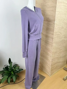 Detail of lavender purple zip-up hoodie set showing soft fabric texture and thumbhole cuffs