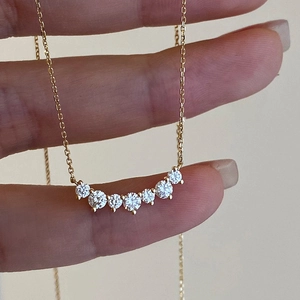 18K gold-plated S925 sterling silver necklace featuring a curved row of 7 clear zircons