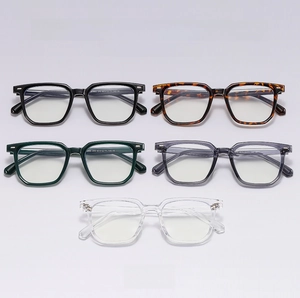 Flat lay of square anti-blue light glasses frames in black, tortoise, grey, and green