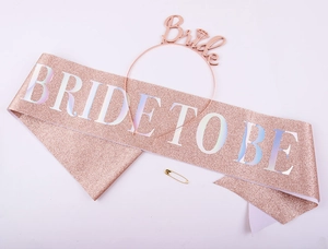 Rose gold Bride headband and Bride to Be glitter sash party accessory set on white background