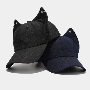 Washed denim baseball cap with Doberman ears and metal rings in black and navy colors