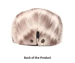 Detailed back view of tie-dye newsboy cap with wood grain texture and metal snaps