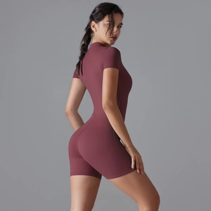 Rear view of sleek burgundy short sleeve yoga bodysuit showing fit and fabric texture
