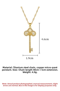 Macro view of crystal crown key pendant showing 4.6cm length and titanium steel chain