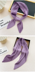 Close-up of lavender purple pleated silk scarf with fine accordion fold texture