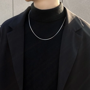 Titanium steel silver flat snake chain necklace worn on a male model's neck for a sleek look