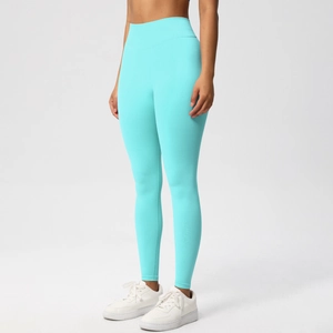 Detailed view of high-waist mint green seamless yoga pants with peach butt lifting design