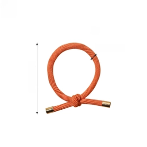 Detail of orange braided elastic hair tie with gold metal clasp and knot, 5.5cm diameter