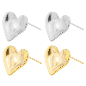 Close-up of heart-shaped 304 stainless steel earrings with gold and silver hammered texture