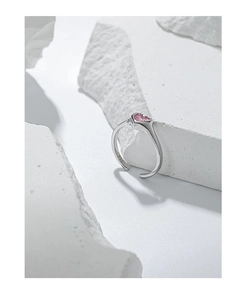 Macro detail of S925 sterling silver ring featuring a pink heart zirconia on a stone base