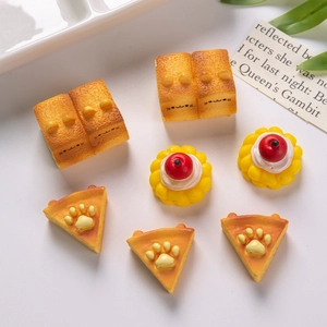 Detailed collection of seven miniature resin cat toast and dessert dollhouse charms