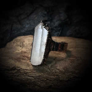 Macro shot of an irregular natural crystal stone set on a vintage-style adjustable ring