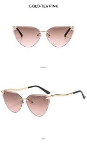 Detail view of gold-rimmed cat-eye sunglasses with gradient tea pink lenses and metal legs