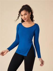 Detail of high side slit and ruched drawstring on royal blue slim yoga top