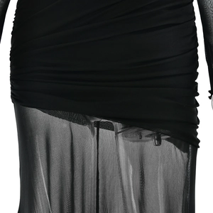 Detail of ruched black dress showing the contrast between pleated fabric and sheer mesh