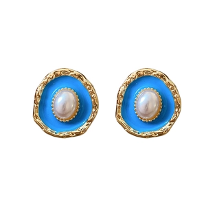 Vintage oval gold earrings with blue enamel, white pearl center and silver needle back
