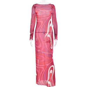 Close-up of red mesh dress with abstract wave patterns and long sheer sleeves detail