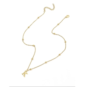 Elegant gold necklace with beaded chain and capital letter K pendant on white background