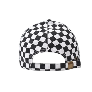 Detail view of cotton checkerboard baseball cap with adjustable antique brass buckle