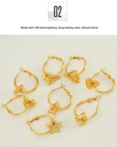 Detailed view of 18K gold plated earrings featuring star and heart shaped charms