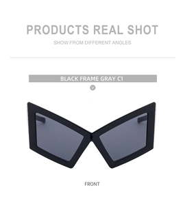 Front view of oversized geometric sunglasses with black frame and dark grey lenses