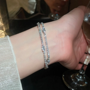 Elegant close-up of 18k gold plated double-layer zircon tennis bracelet on wrist