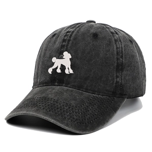 Detail of white poodle embroidery on vintage washed black cotton baseball cap