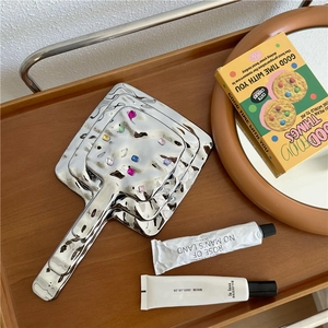 Three-piece set of silver handheld makeup mirrors with colorful gems in vintage style
