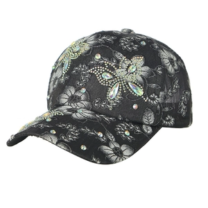 Women's black floral baseball cap with colorful rhinestone embellishments in a side view