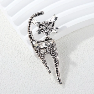 Detailed back view of vintage silver cat brooch showing pin closure and metal texture