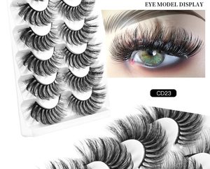 Detail view of 8D faux mink eyelashes CD23 with dense curls and eye model display