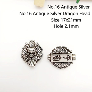 Detailed view of silver dragon head bead with 17x21mm dimensions and 2.1mm hole size