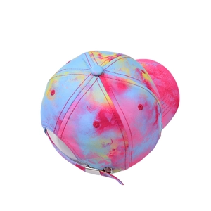 Detailed back view of tie-dye baseball cap featuring an adjustable silver metal buckle