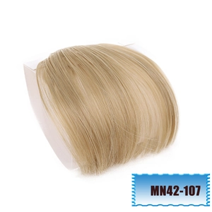 Macro detail of golden blonde synthetic bangs clip-in hairpiece model MN42-107 on white back