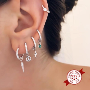925 sterling silver geometric earrings set with lightning, peace and emerald charms