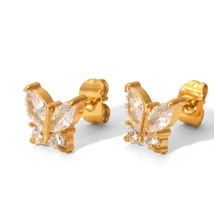 Detailed view of butterfly-shaped gold stud earrings set with sparkling zircon stones