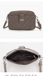 Detail view of grey quilted crossbody phone bag with internal slots for cards and cash