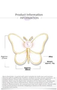 Macro shot of 38x27mm butterfly brooch with white enamel wings and round pearl inlay