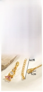 Detailed view of golden mermaid princess pendant with colored zircon and opal stone