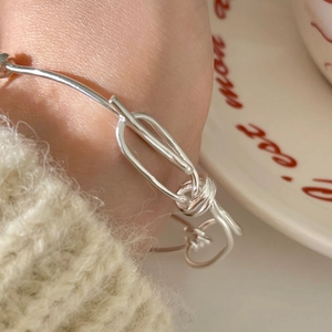 925 sterling silver knotted bracelet with a delicate heart pendant charm for women